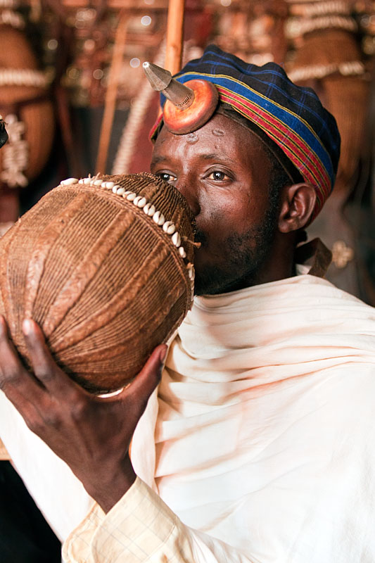 23a. Borana chief drinking locally brewed beer   Kenya
